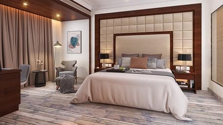 Suite with a king size bed and lamps on each side of the bed at BluSalzz Residence, Amritsar.